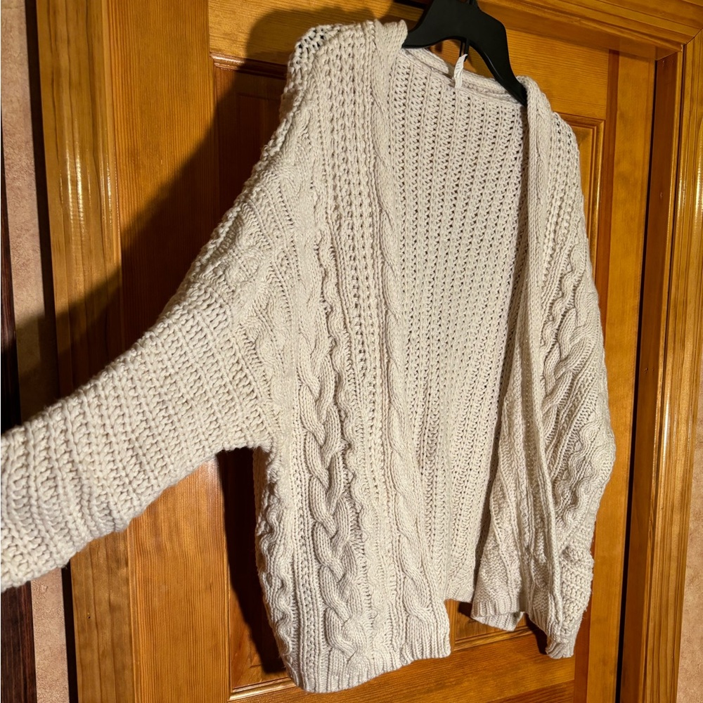 Light cream cableknit cardigan say what size medium Doleman sleeve Oversized